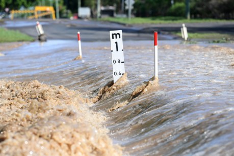 Floods isolating towns as SEQ readies for a wet weekend