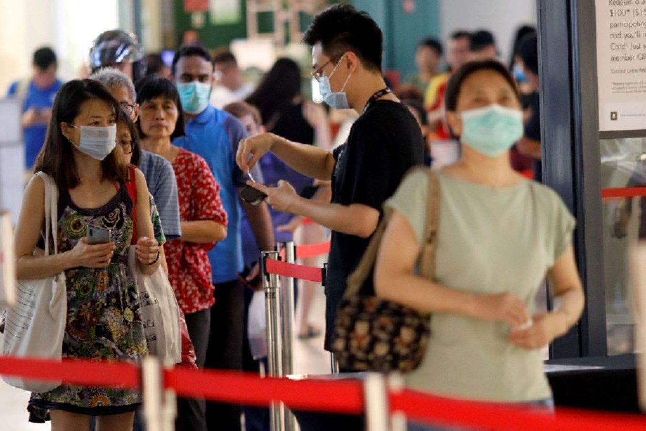 Singapore's early action against the coronavirus outbreak was seen by some as a model response. Now Prime Minister Scott Morrison is in discussions about a possible travel bubble with Australia.(Photo: AP: Edgar Su)