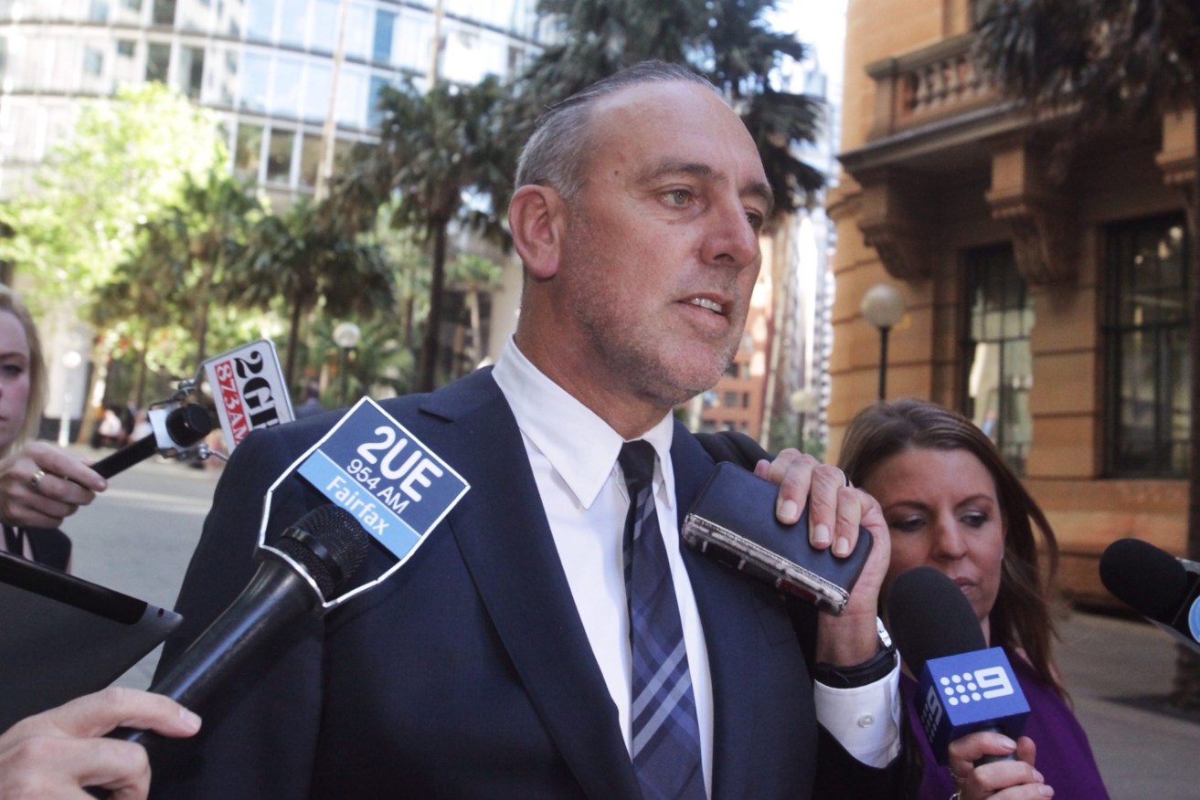 Founder of the Hillsong Church, Pastor Brian Houston leaves the Royal Commission into Institutional Responses to Child Sexual Abuse hearings in Sydney, Tuesday, Oct. 7, 2014. The hearing has been told the senior pastor at the popular Hillsong Church accused a child sex abuse victim of tempting his father. (AAP Image/Mick Tsikas) 