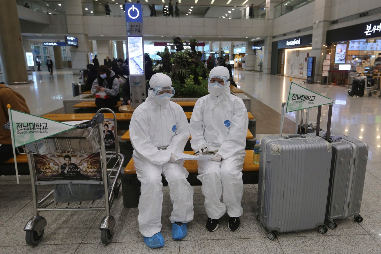 Investigators say it may be a few years before the source of the coronavirus is known. (AP Photo/Ahn Young-joon)