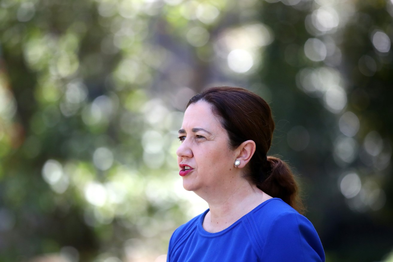 Premier Annastacia Palaszczuk says she is wrestling with "really hard decisions".(Photo: AAP Image/Jono Searle) 