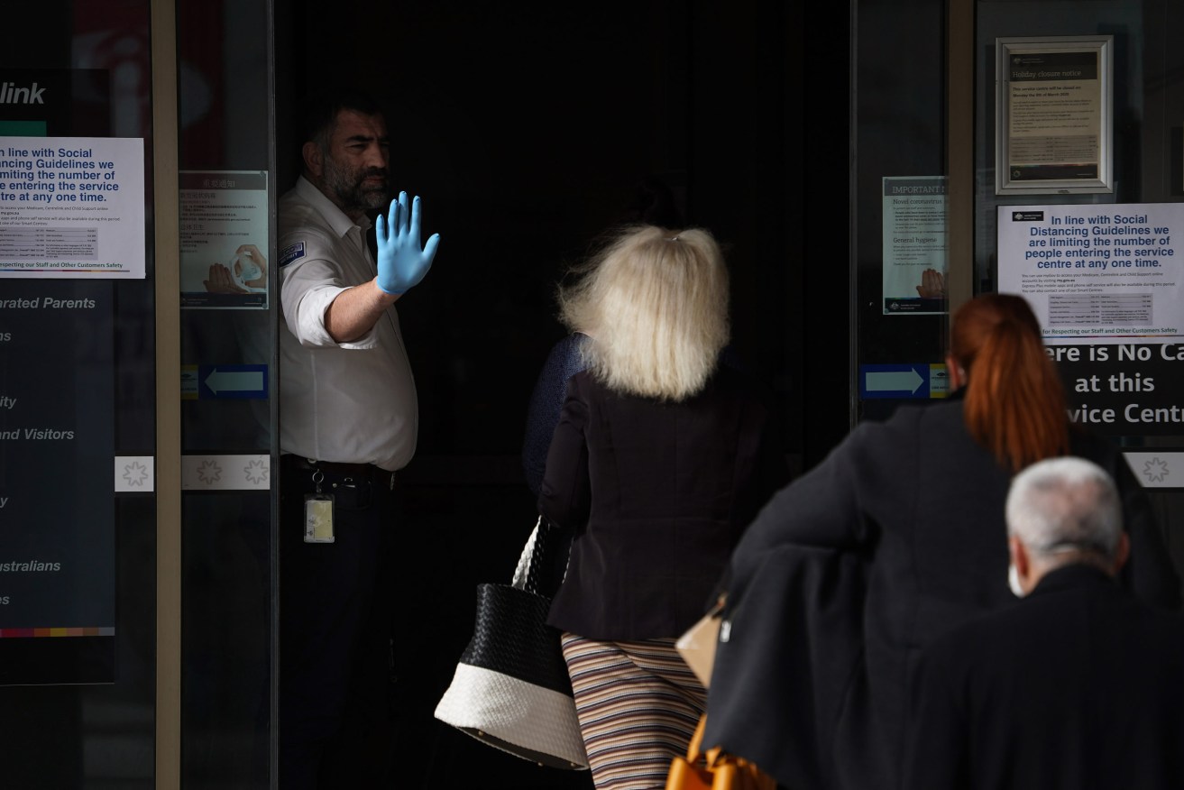 People are queuing outside a Centrelink offices around Australia  with people attempting to register for the Jobseeker allowance in the wake of business closures due to the COVID-19 pandemic. (Photo: AAP Image/Stefan Postles) 