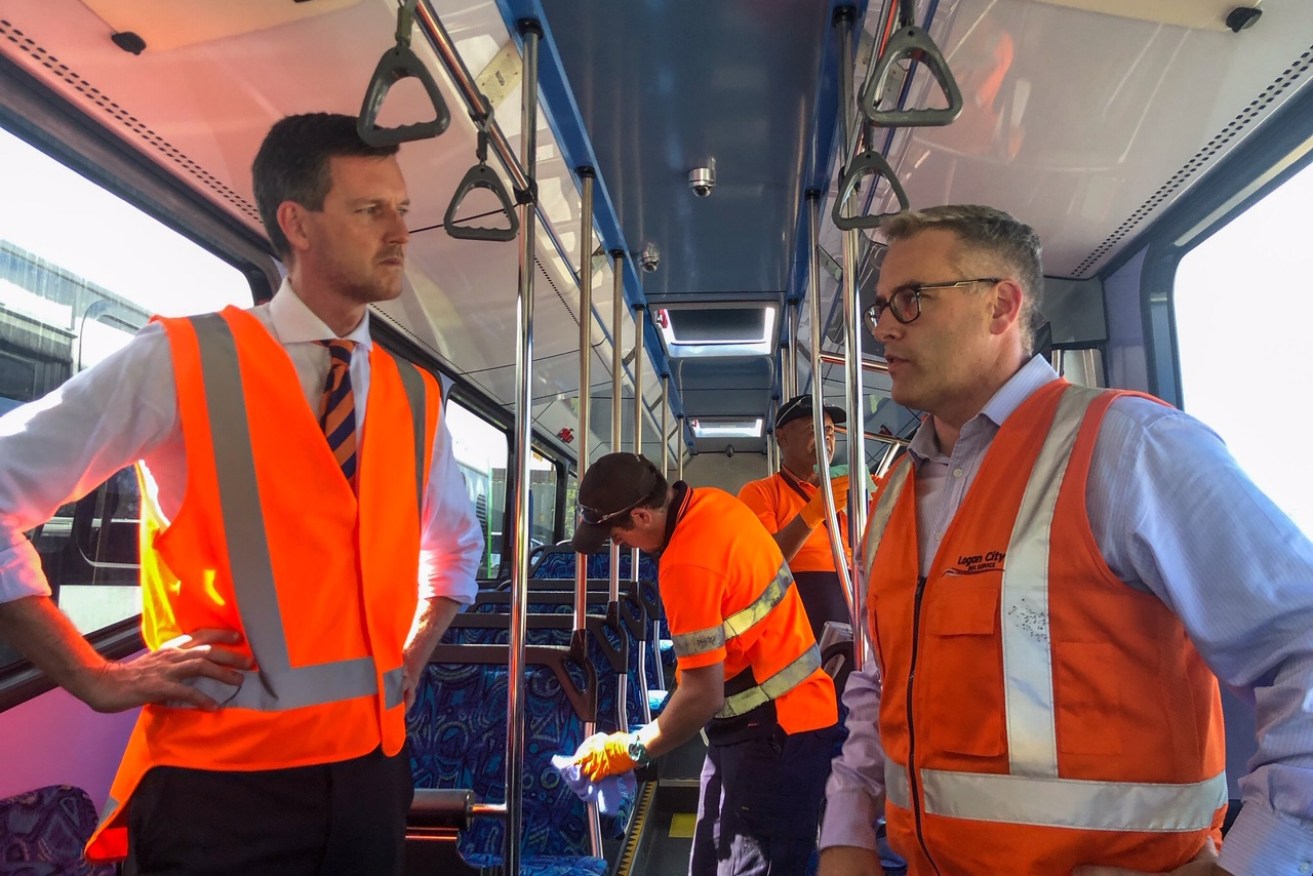 Transport Minister Mark Bailey inspects a public transport cleaning operation. Source: Mark Bailey, Facebook.