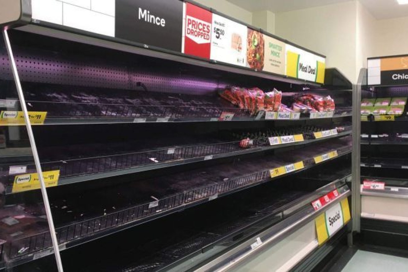 An empty fresh meat fridge at a Woolworths supermarket near Brisbane yesterday. Photo: ABC