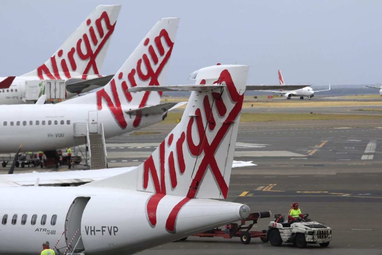 Virgin planes sit idle on the tarmac. (Photo: EPA/BARBARA WALTON)