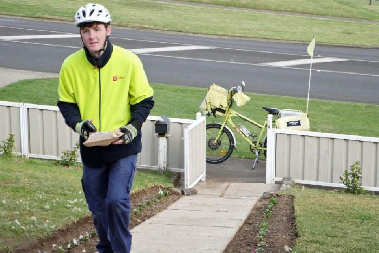 Postie Leon Craig says "most people are understanding" about the delays. (ABC News)