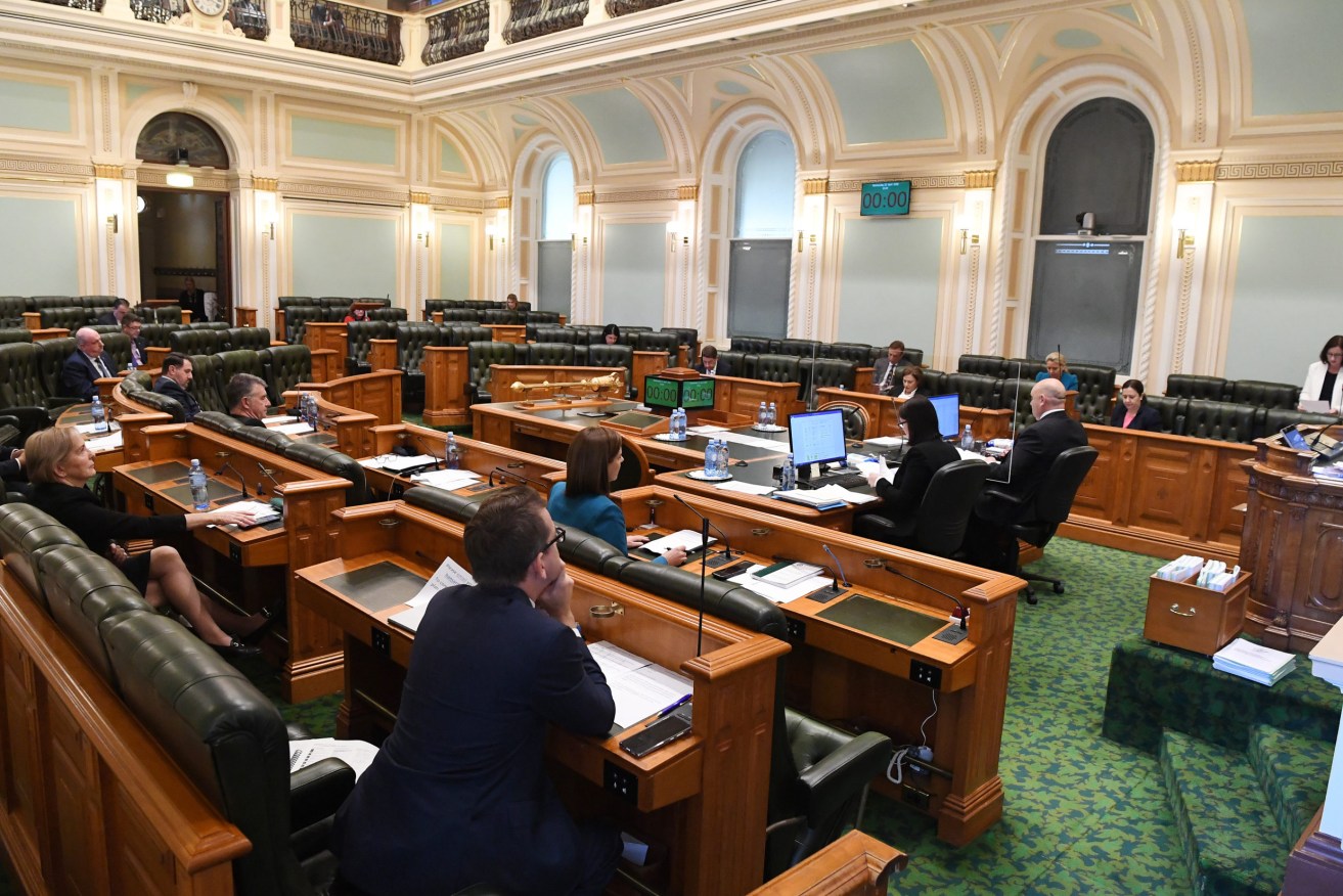 A reduced number of members due to social distancing measures is seen during a sitting of the Queensland Parliament in Brisbane, Wednesday, April 22, 2020. Queensland has recorded no new cases of coronavirus in the past 24 hours. (Photo: AAP Image/Dan Peled) 