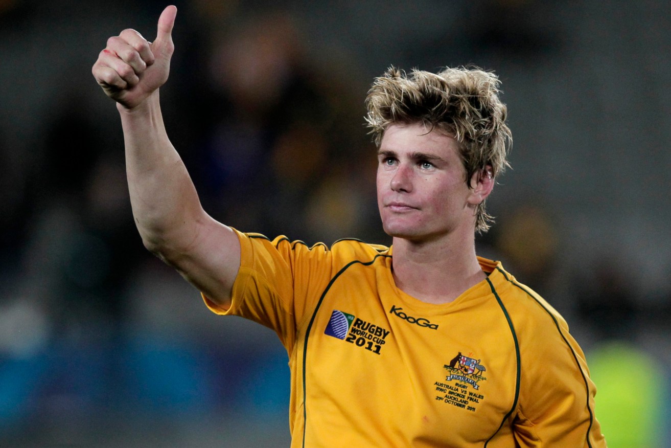 Australia's Berrick Barnes acknowledges the crowd after his team's victory over Wales in the bronze medal Rugby World Cup game at Eden Park, in Auckland, New Zealand, Friday, Oct. 21, 2011.(AP Photo/Mark Baker)