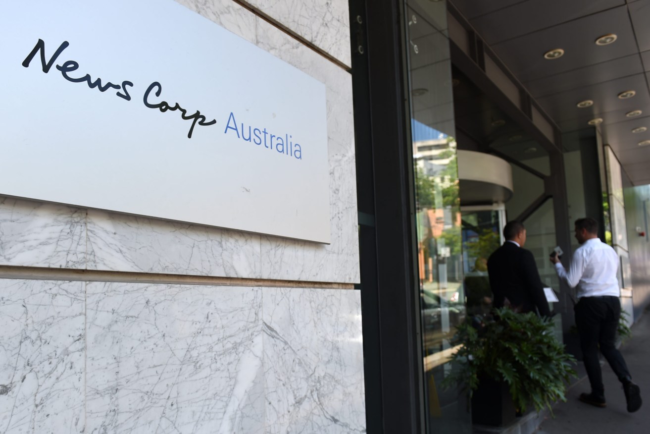 News Corp has announced the closure of almost 100 of its regional and community print publications. (AAP Image/Paul Miller) 