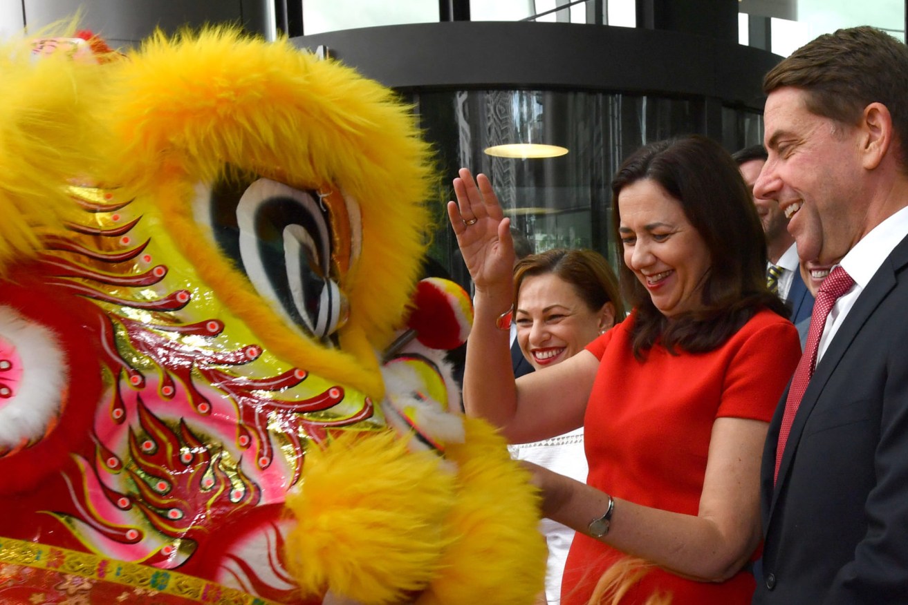 Premier Annastacia Palaszczuk (left) has offered no direct criticism of the Chinese Government's decision to suspend beef imports from three Queensland abattoirs.  (Photo: AAP Image/Darren England)