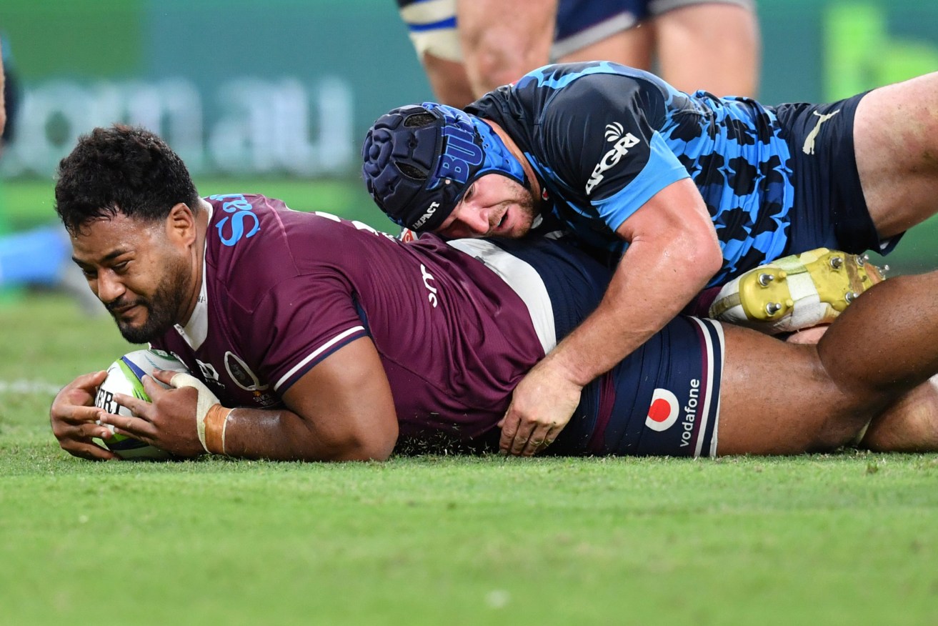 Taniela Tupou (left) of the Reds scores a try during the Round 7 Super Rugby match between the Queensland Reds and the Bulls at Suncorp Stadium in Brisbane, Saturday, March 14, 2020. (AAP Image/Darren England) 