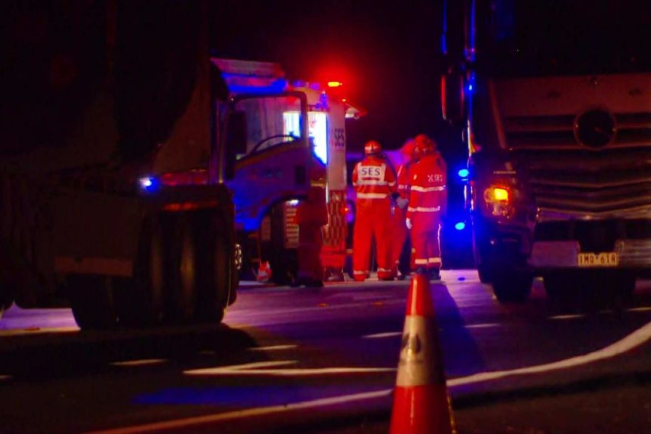 Emergency workers at the scene of a fatal road range incident which claimed the lives of two men (Photo: ABC).