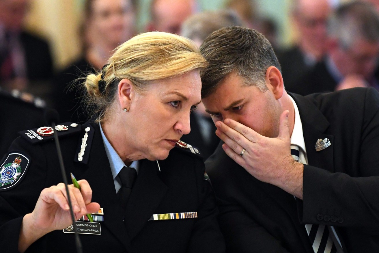 Queensland Police Minister Mark Ryan (right) and Commissioner Katarina Carroll. Ryan will support the renewal of her contract. (Photo: AAP Image/Dan Peled) . 