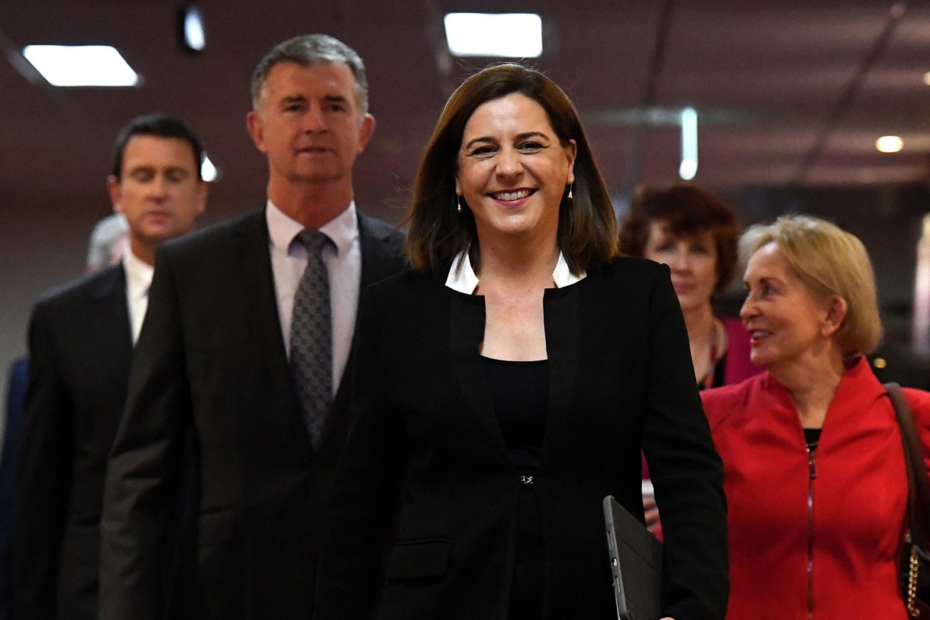 Queensland Opposition leader Deb Frecklington (centre) and her deputy Tim Mander (left). (Photo: AAP Image/Dan Peled) 