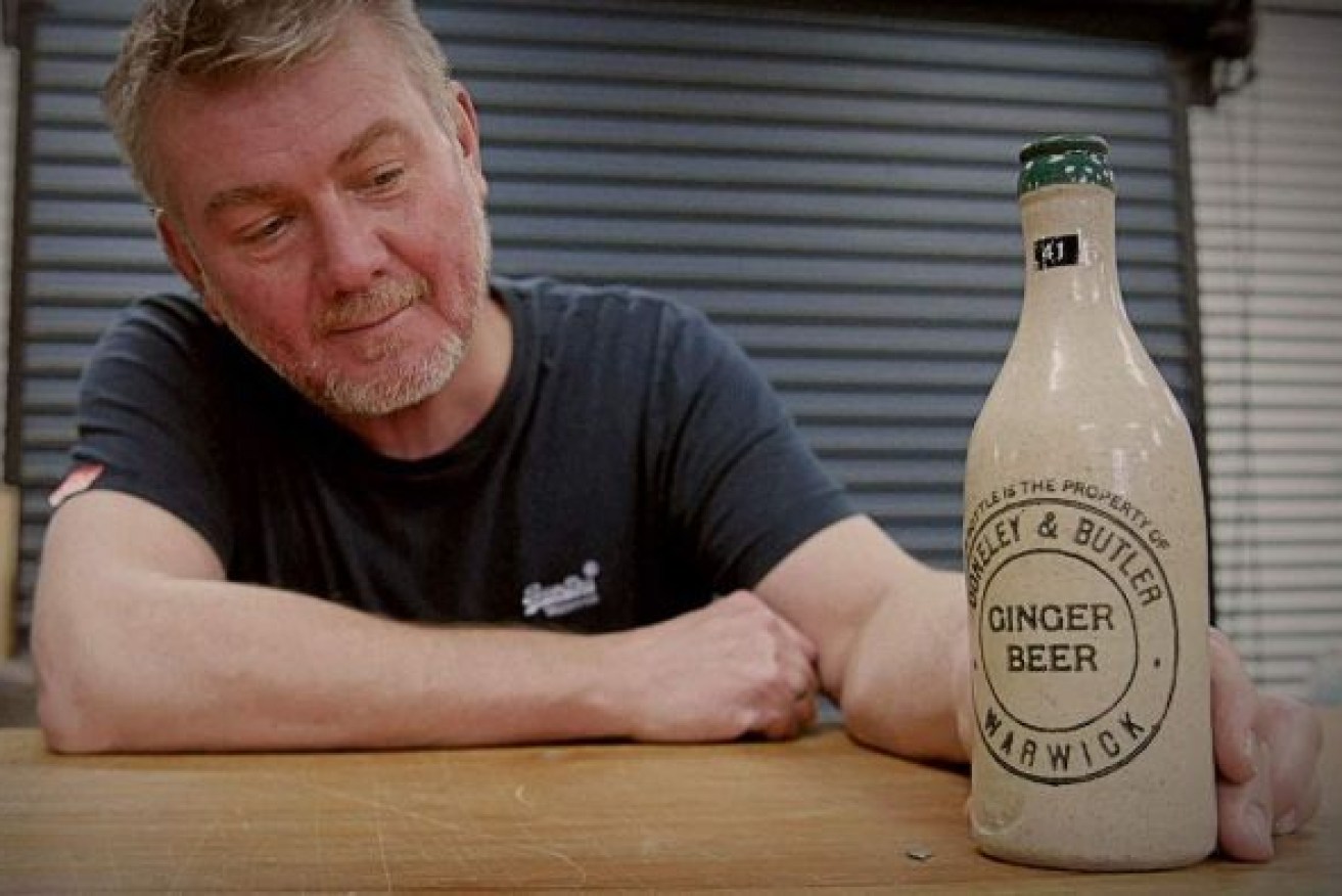 Auctioneer Graham Lancaster says the Warwick bottle is very rare. (Photo: ABC)