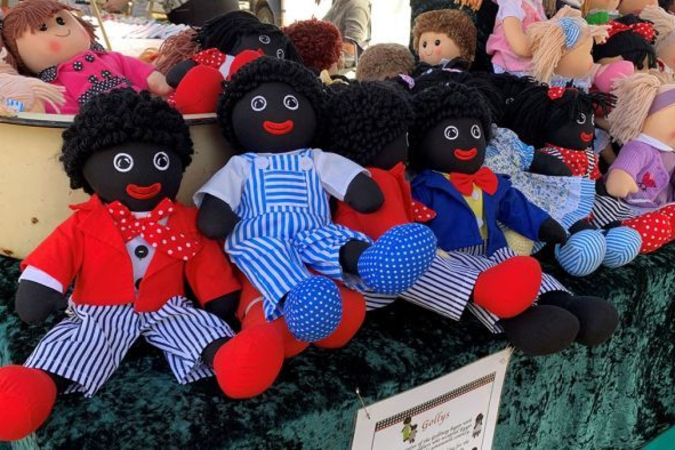 Several dolls, advertised as 'Gollys', at a Toowoomba market stall on June 13. Photo: ABC