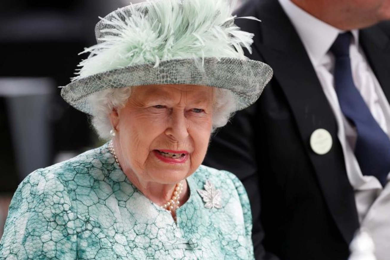 The 95-year-old monarch will continue working despite her Covid infection.(Reuters: Paul Childs)