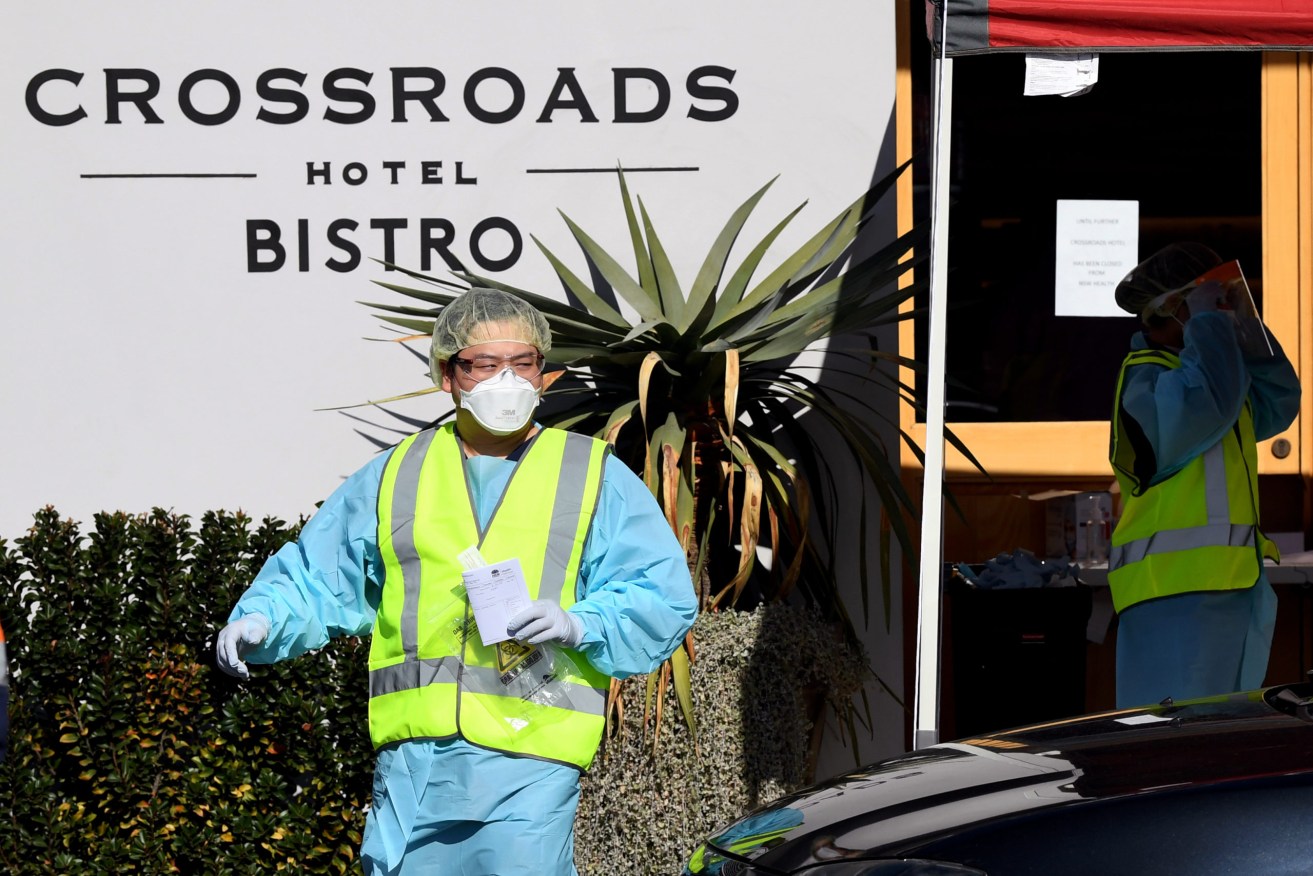 One man is thought to be linked to positive tests by 34 other patrons of Sydney's Crossroads Hotel. (Photo: AAP Image/Joel Carrett) 