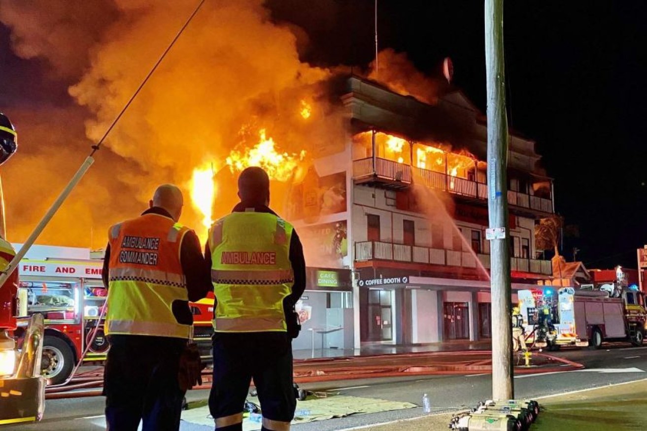 Emergency services workers fight the blaze at Bundaberg's Federal Backpackers (Picture Qld Ambulance Service)