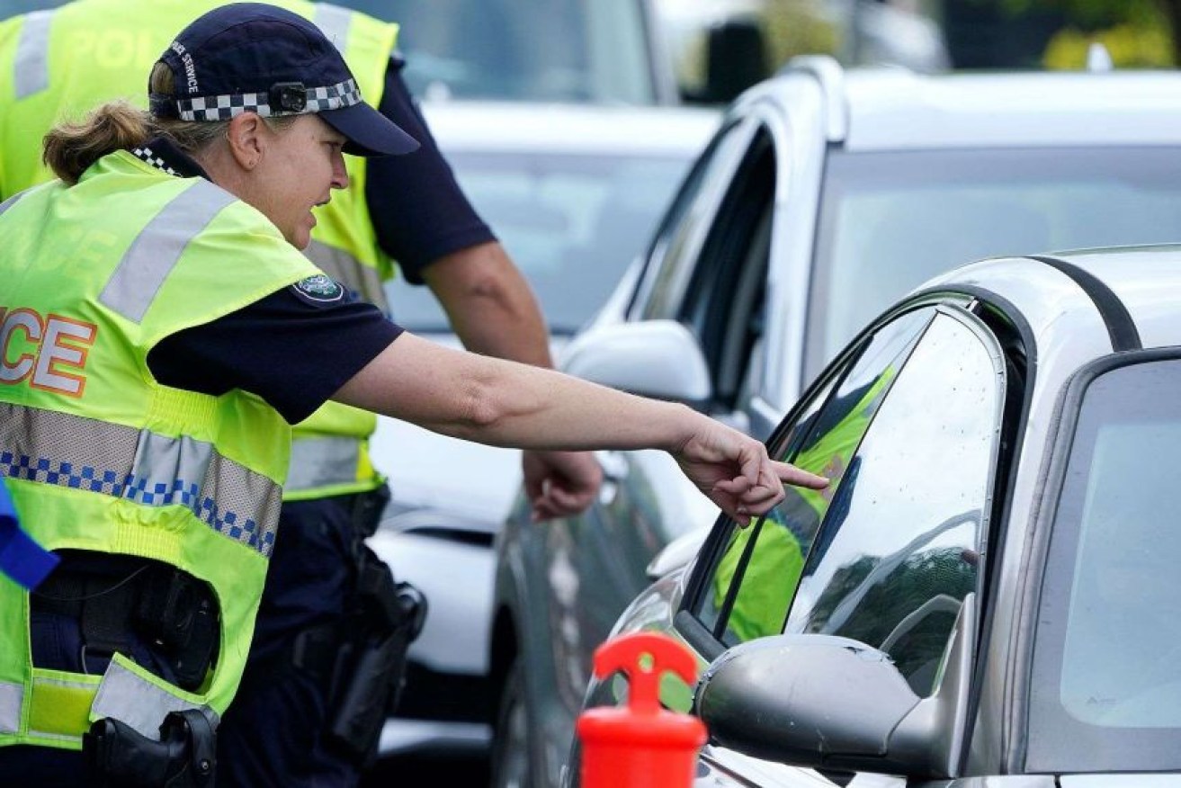 Queensland police were active in 2020, enforcing the COVID-19 rules and regulations. (Photo Dave Hunt, AAP).