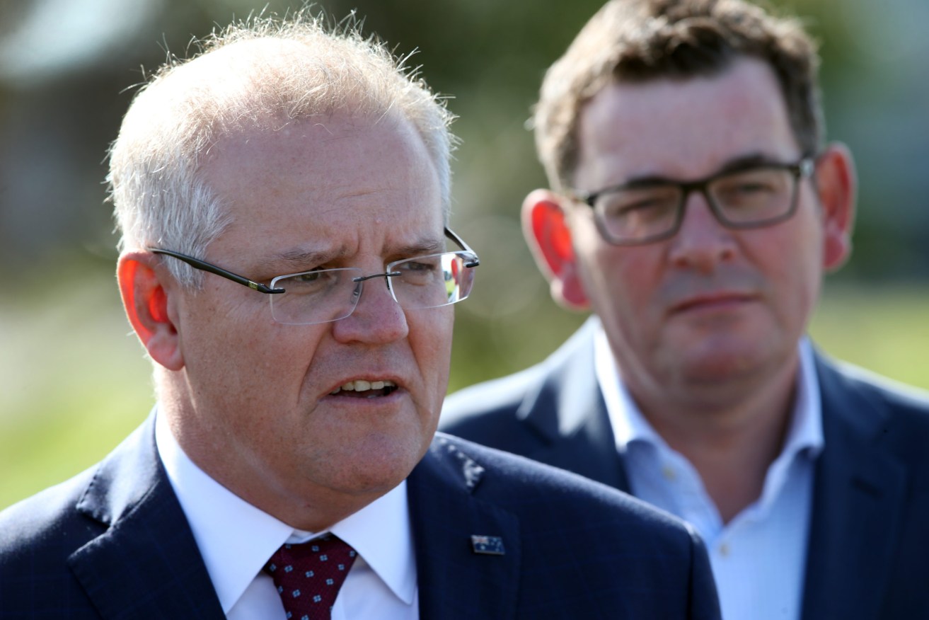 Prime Minister Scott Morrison (left) heads back to parliament this week with the Coalition and Labor 50-50 on a two-party preferred basis, according to Newspoll. (Photo: AAP Image/David Crosling) 