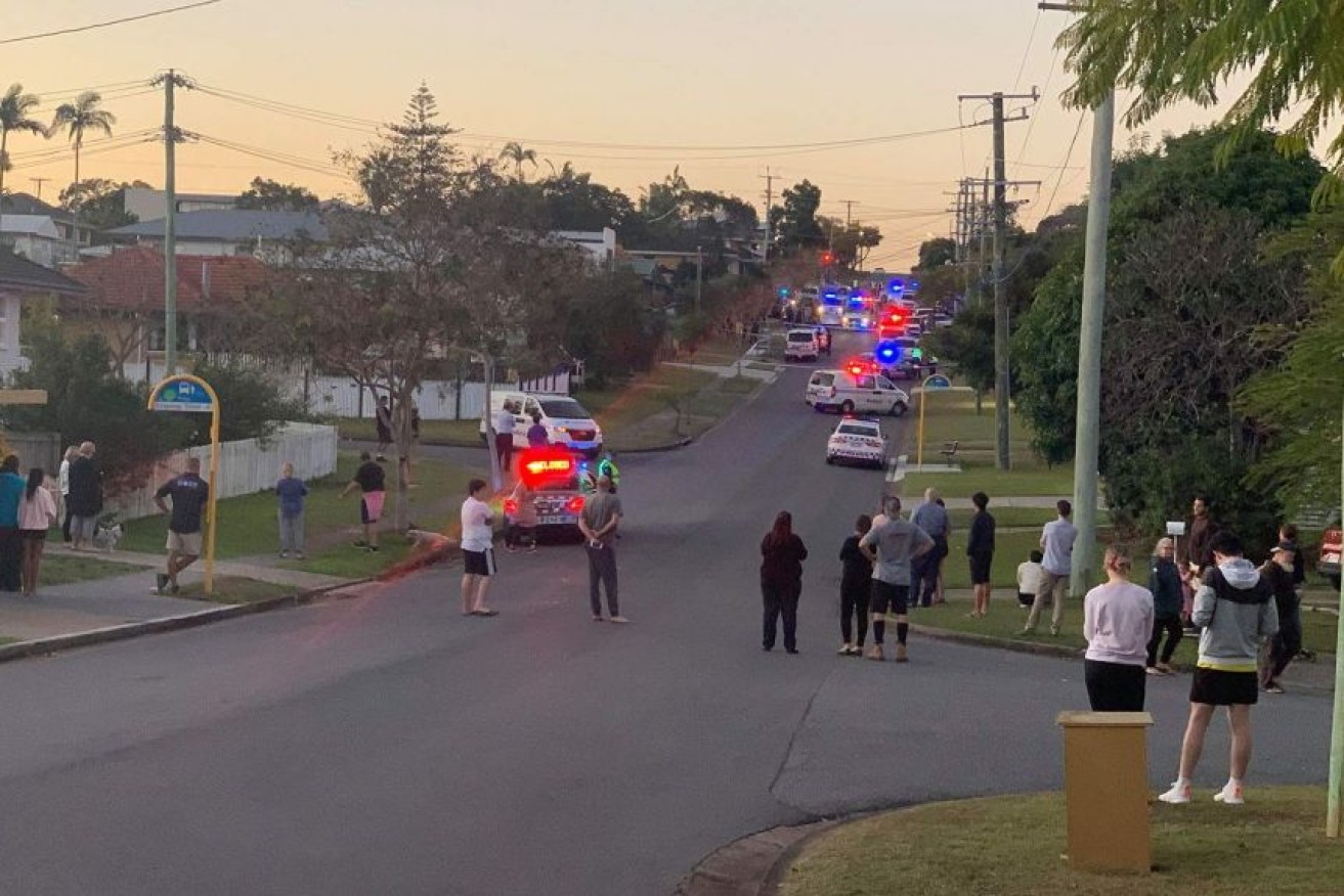 Neighbours watched on as a heavy police presence arrived in the Mount Gravatt street on Wednesday.(Supplied)