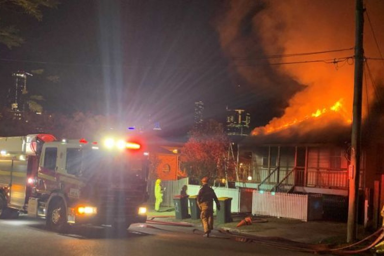 Two houses and cars were damaged in the suspicious fires at Highgate Hill. Photo: ABC