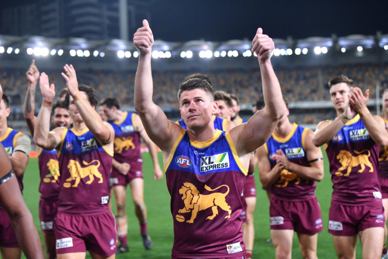Quarantine rules mean wives and families of Brisbane Lions players must move out to allow the team to play a home match this weekend. (AAP Image/Darren England) 