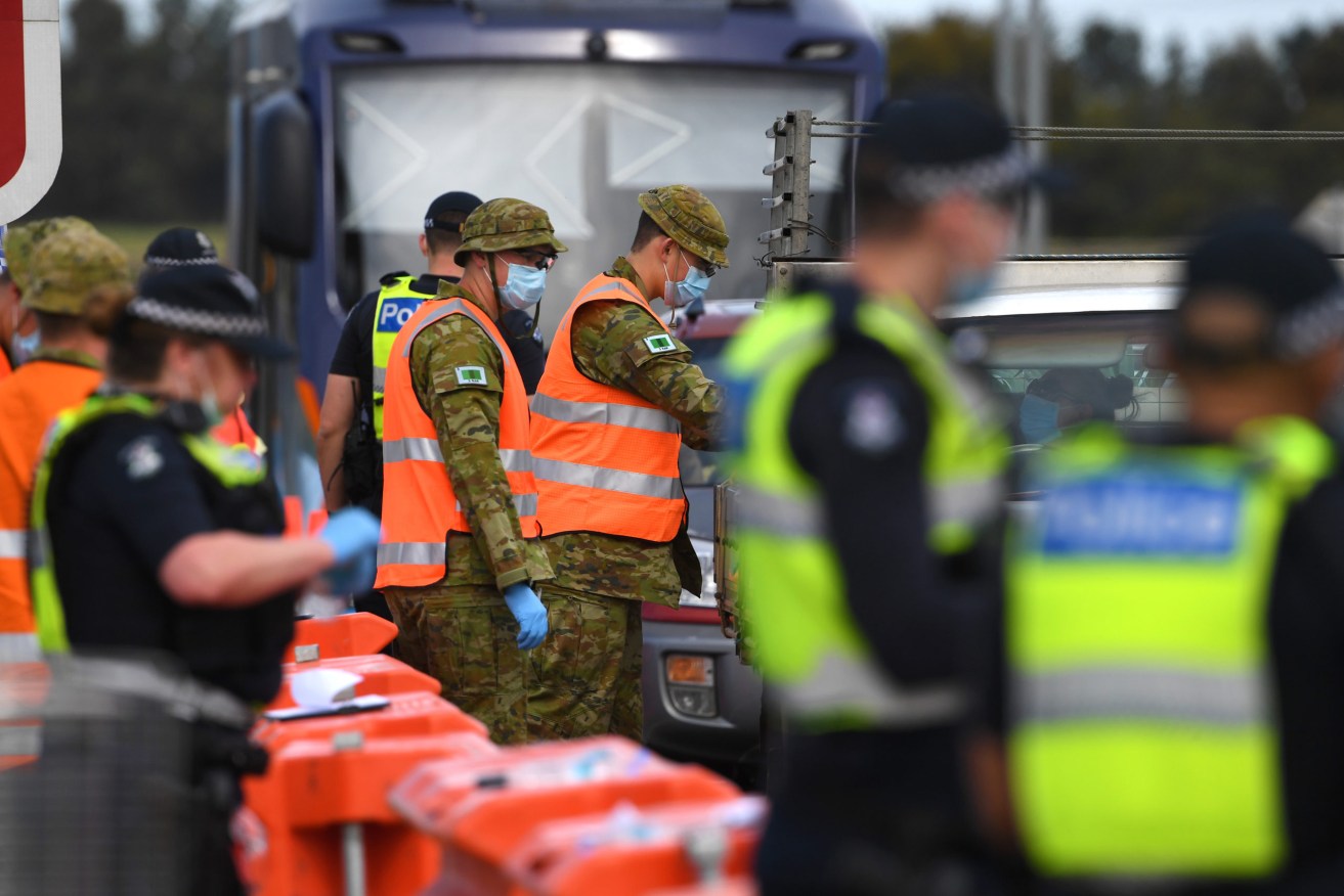 ADF personnel helping patrol state borders will be withdrawn from Queensland. (Photo: AP Image/James Ross) 