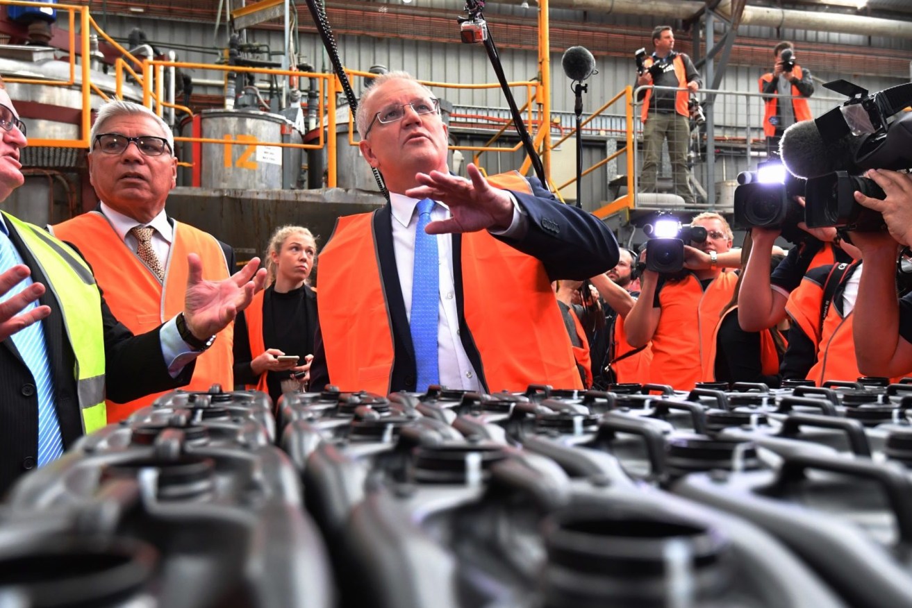 Prime Minister Scott Morrison (centre) says Australia needs to 'keep making things'. (AAP Image/Dean Lewins) 