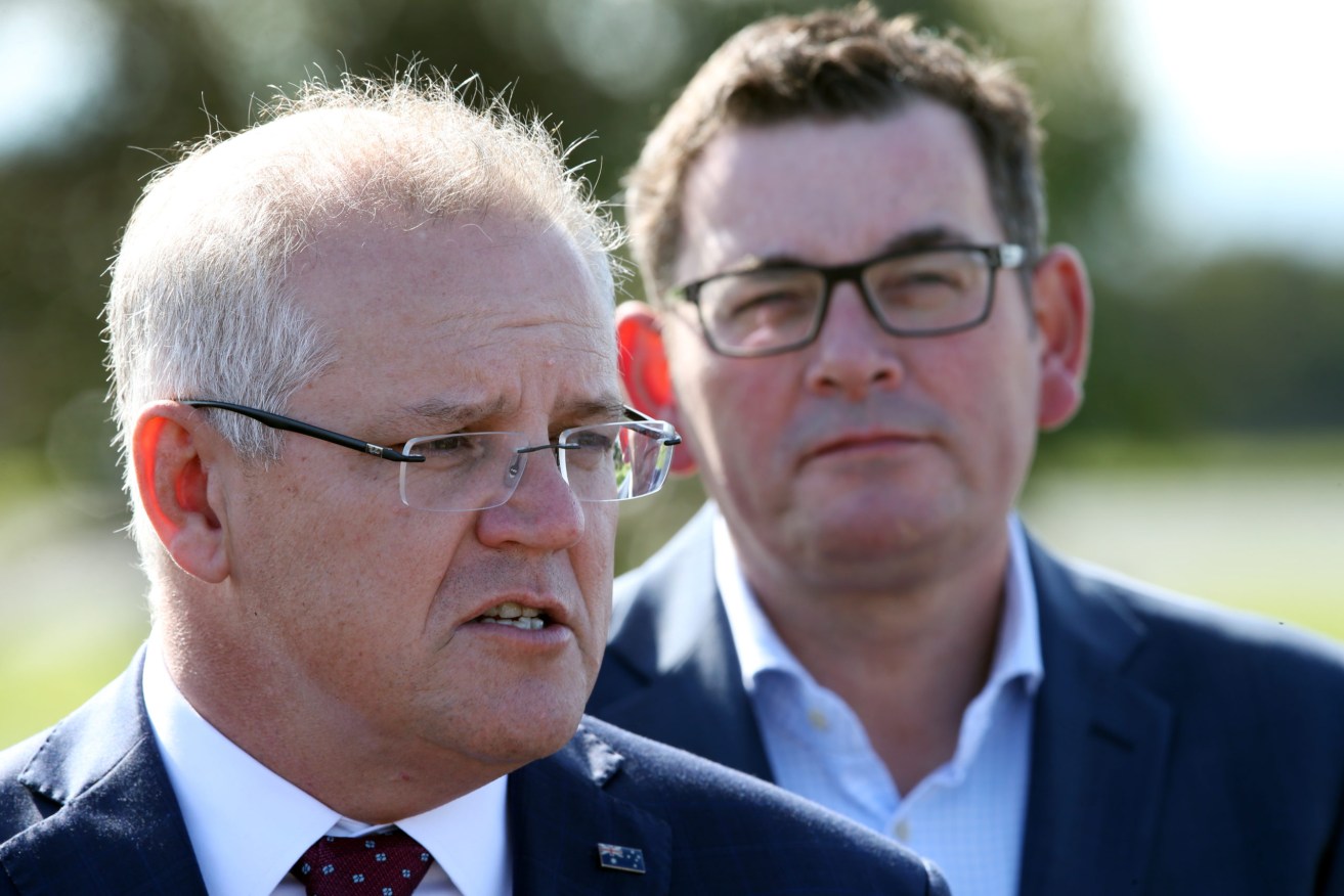 Prime Minister Scott Morrison and Victorian Premier Daniel Andrews have reached an agreement on thresholds for emergency assistance payments. (Photo: AAP Image/David Crosling) 