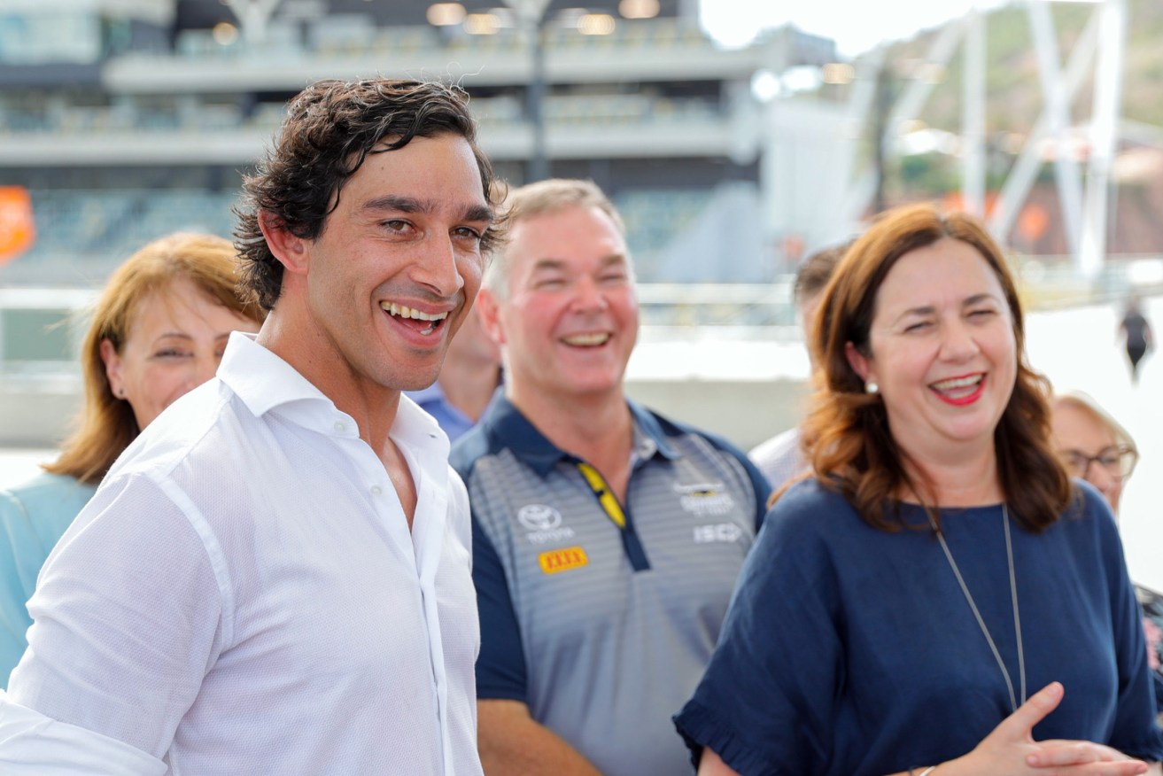 Former NRL Player Johnathan Thurston (left) and Queensland Premier Annastacia Palaszczuk (right) pose for a photograph in Townsville during the campaign. (Photo: AAP Image/Cameron Laird)