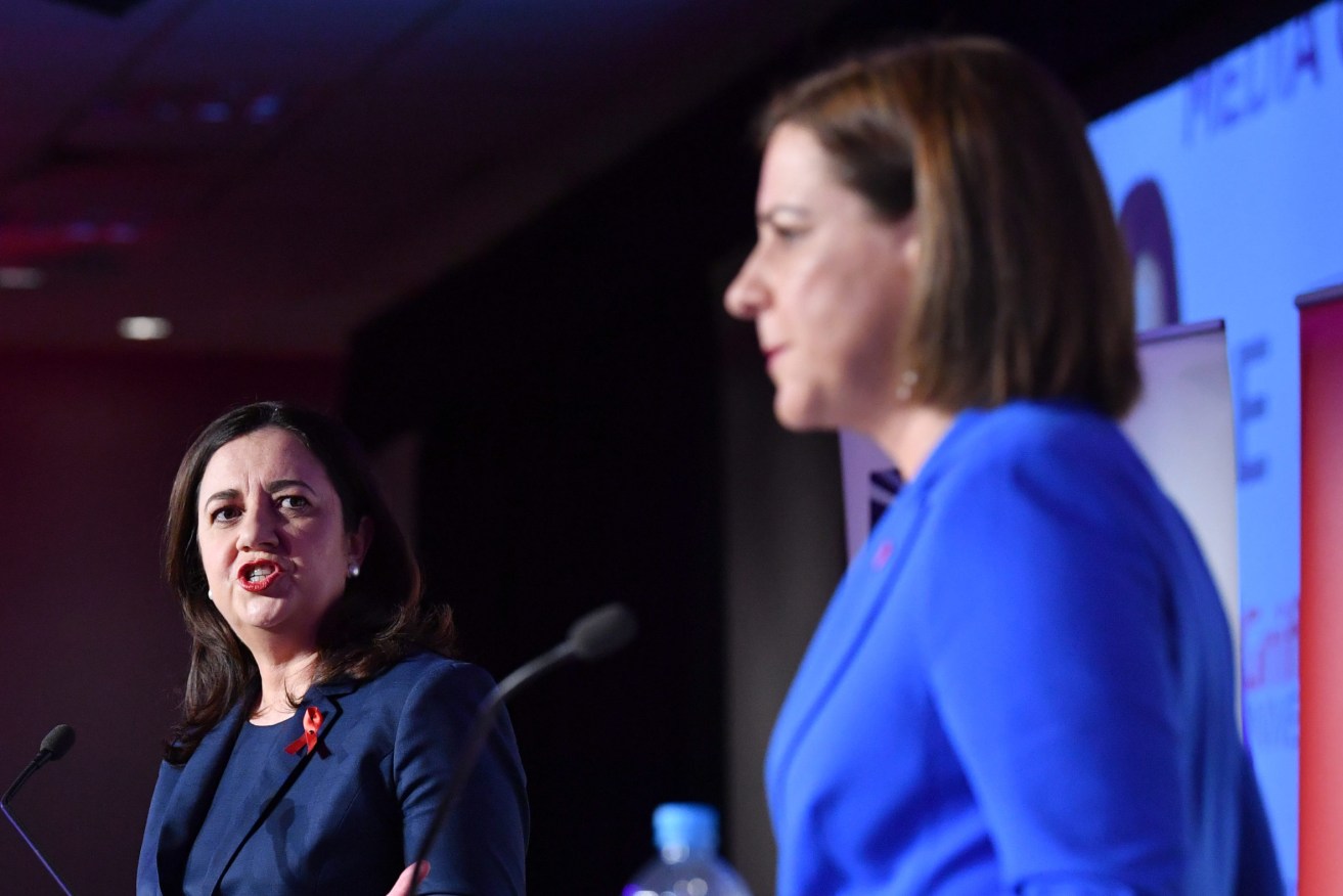 Queensland Premier Annastacia Palaszczuk (left)  and Opposition Leader Deb Frecklington (right) are seen during the leaders debate at the Queensland Media Clubon Friday.. (AAP Image/Darren England) 