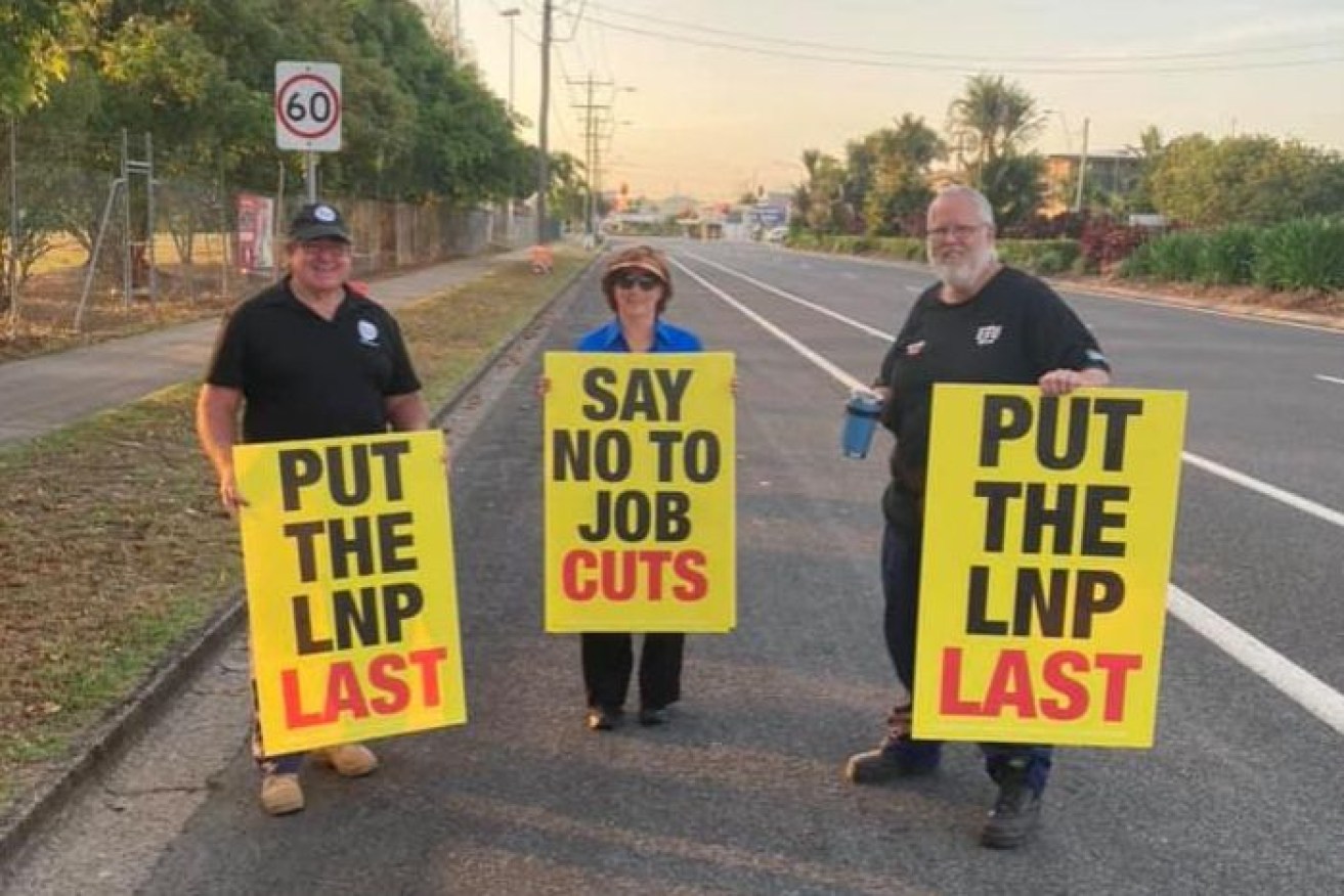 Election campaigners in Barron River were photographed holding signs saying: "Put the LNP last."(Facebook: Robert Hill)