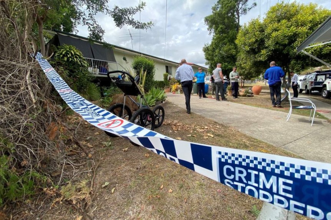 Detectives at the Inala home of Maureen Anne Enright shortly after her arrest.(ABC News: Baz Ruddick)