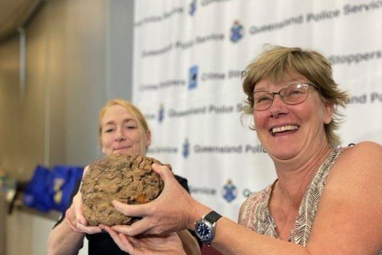 Crystal Caves store managers Ghislaine Gallo and Cecelia Boissevain are reunited with the stolen Wolfe Creek meteorite (Photo: ABC)