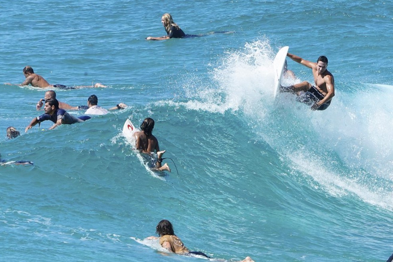 Surfers at Duranbah Beach on the Gold Coast. (AAP Image/Dave Hunt) 