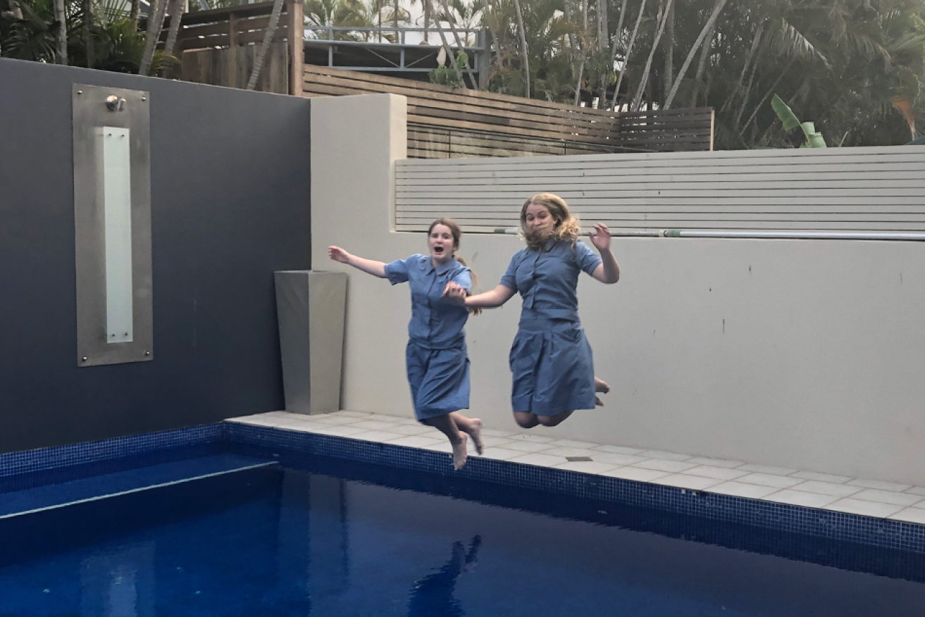 Jumping into the pool with their uniforms on has become a tradition on the final day of school each year for Madonna King's children.