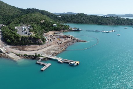 Divers stitch together the foundations of Shute Harbour after cyclone