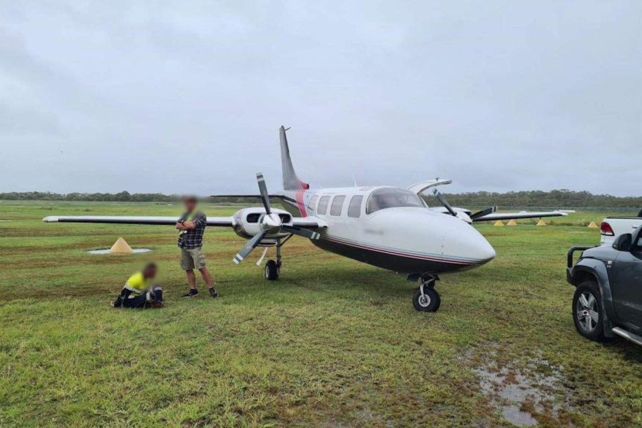Two men were aboard the plane, meeting a third man on the tarmac. (Photo: Queensland Police Service)