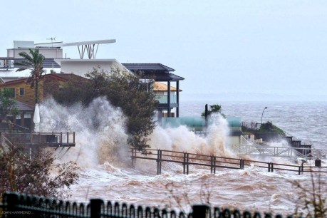 A major event: Wild winds, floods and powerful surf wreak havoc in two states
