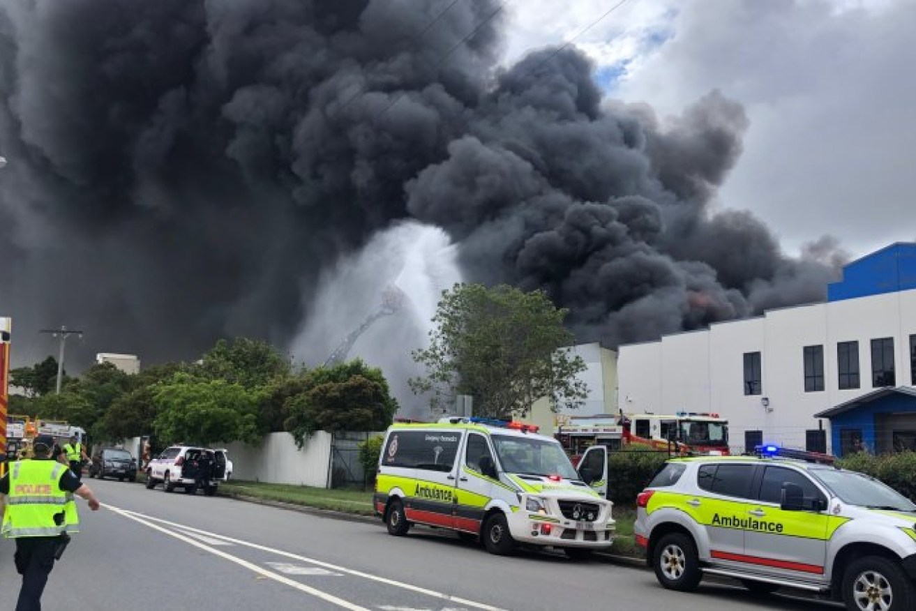 Emergency services at the scene of a huge warehouse fire in Hemmant (Pic: QAS) 