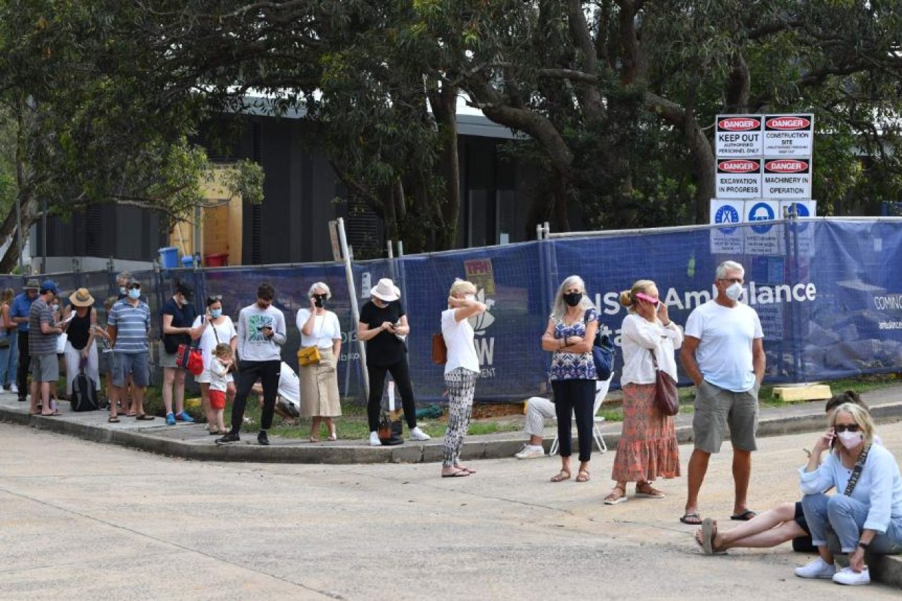People have been queuing outside Mona Vale Hospital all morning to get tested. Photo: AAP 