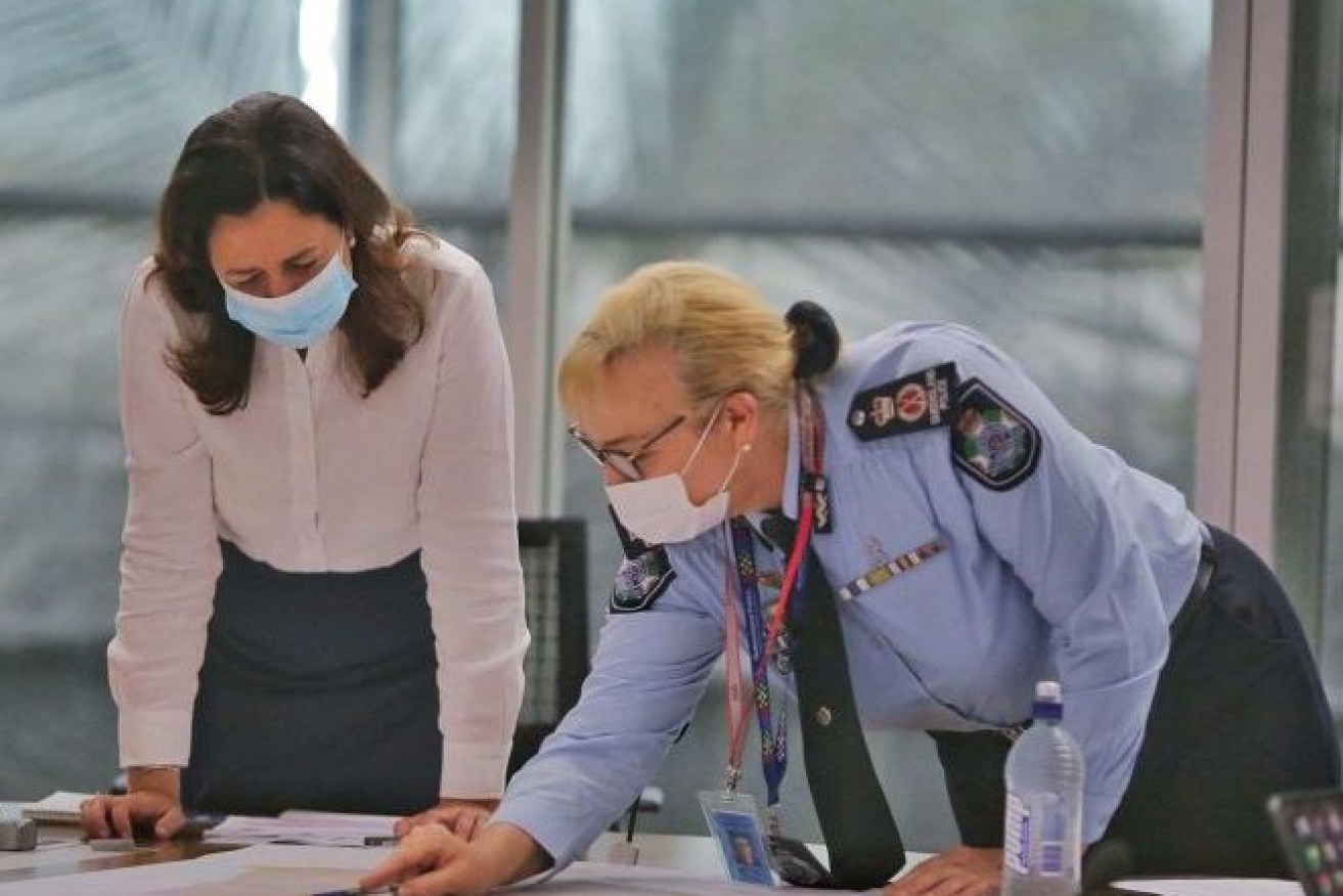 Former Queensland Premier Annastacia Palaszczuk and ex-Queensland Police Commissioner Katarina Carroll wore masks during the Covid pandemic. (Image: AAP)