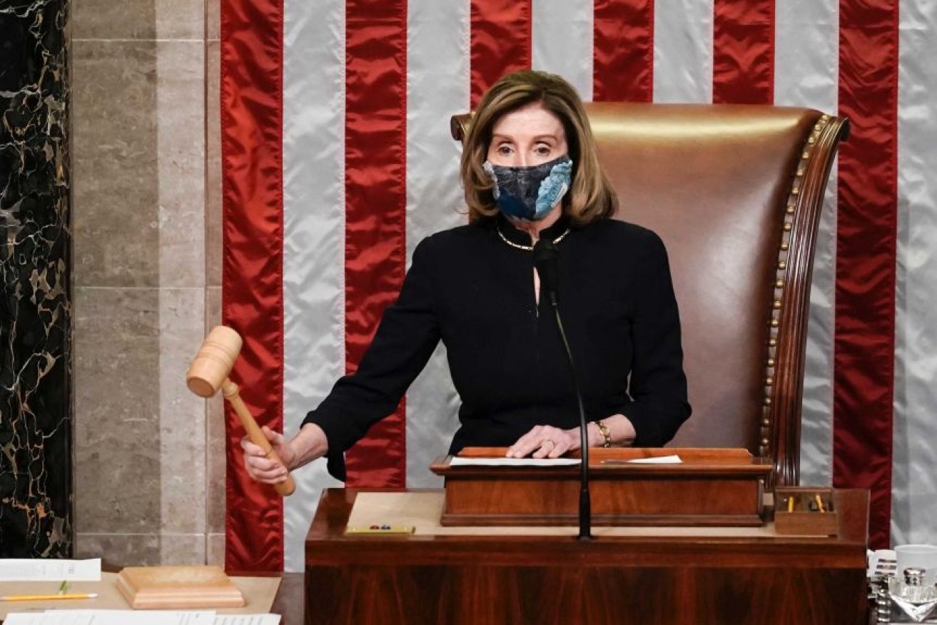 Speaker of the House Nancy Pelosi presides over the vote to impeach President Donald Trump. (Photo: AP)