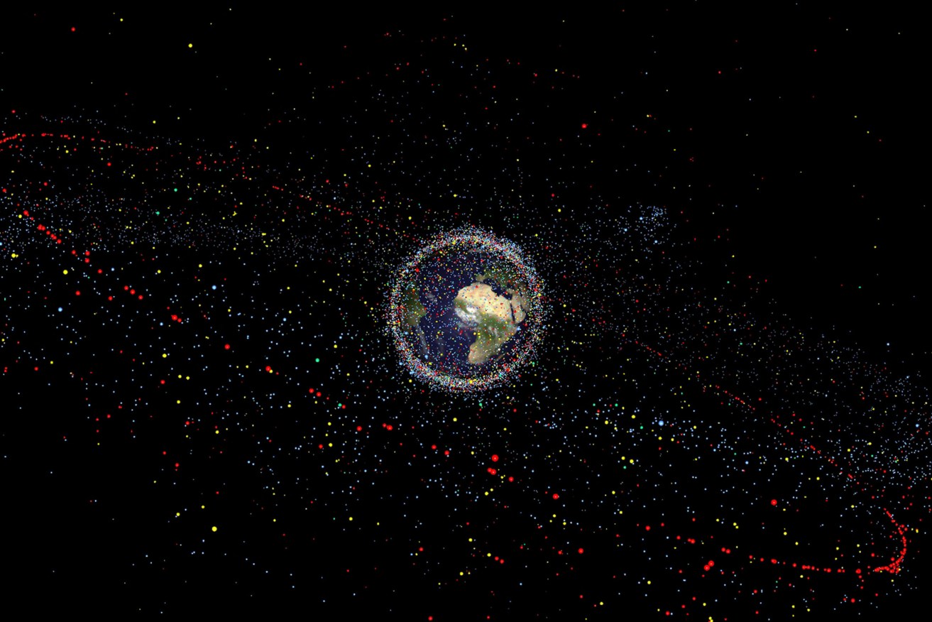 NB: Size of debris exaggerated as compared to the Earth An artist's impression of space debris around Earth. (Source: ESA/PA)