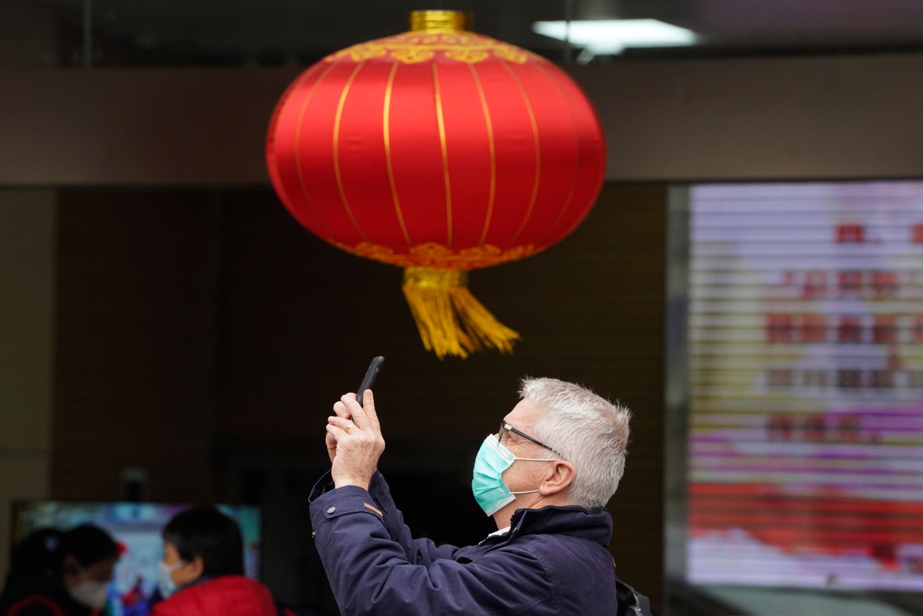Australian doctor Dominic Dwyer of the World Health Organization team arrives for a field visit at the Service Center for Party Members and Residents of Jiangxinyuan Community in Wuhan in central China's Hubei province. (AP Photo/Ng Han Guan)