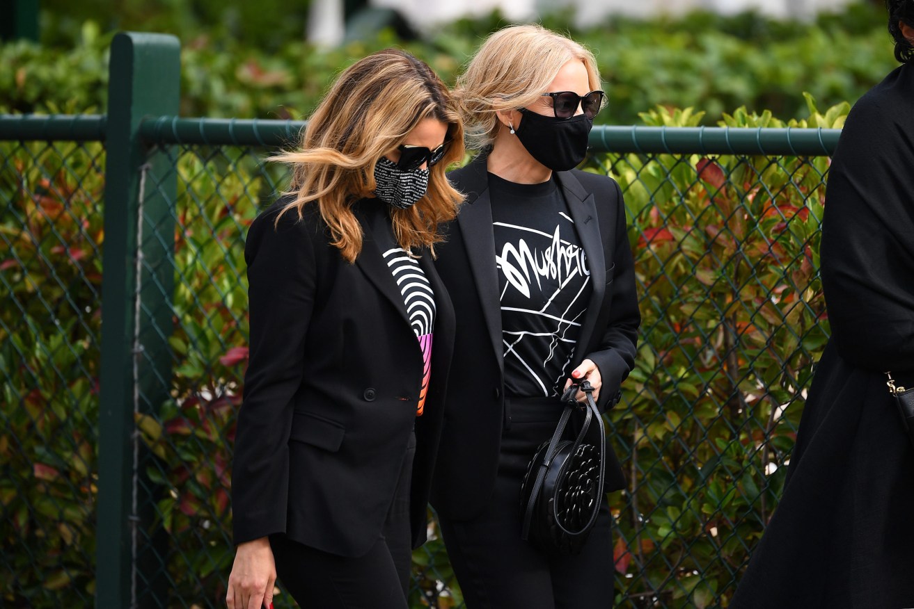 Dannii (left) and Kylie Minogue arrive to the funeral of Michael Solomon Gudinski in Melbourne. (AAP Image/James Ross) 