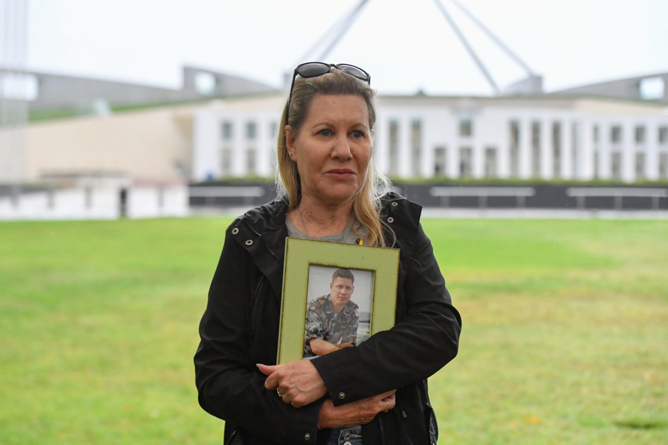 Julie-Ann Finney at a rally to protest veteran suicide outside Parliament House in Canberra. (Photo:AAP Image/Mick Tsikas)