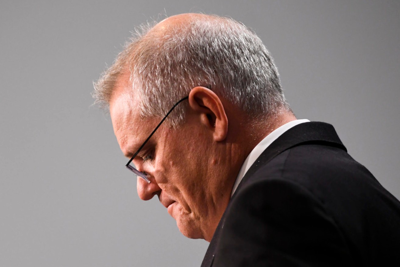 Prime Minister Scott Morrison says he is frustrated with half of the nation in lockdown. (AAP Image/Lukas Coch) 